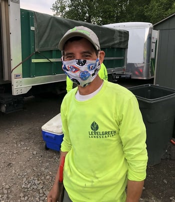 Employee wearing mask made by Joey's mom