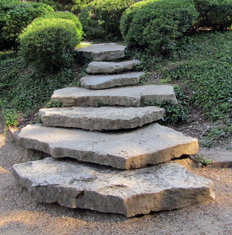 rocks used as stairs in landscaping