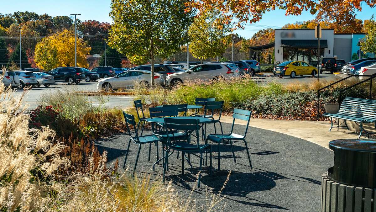 outdoor seating on patio near restaurants and stores