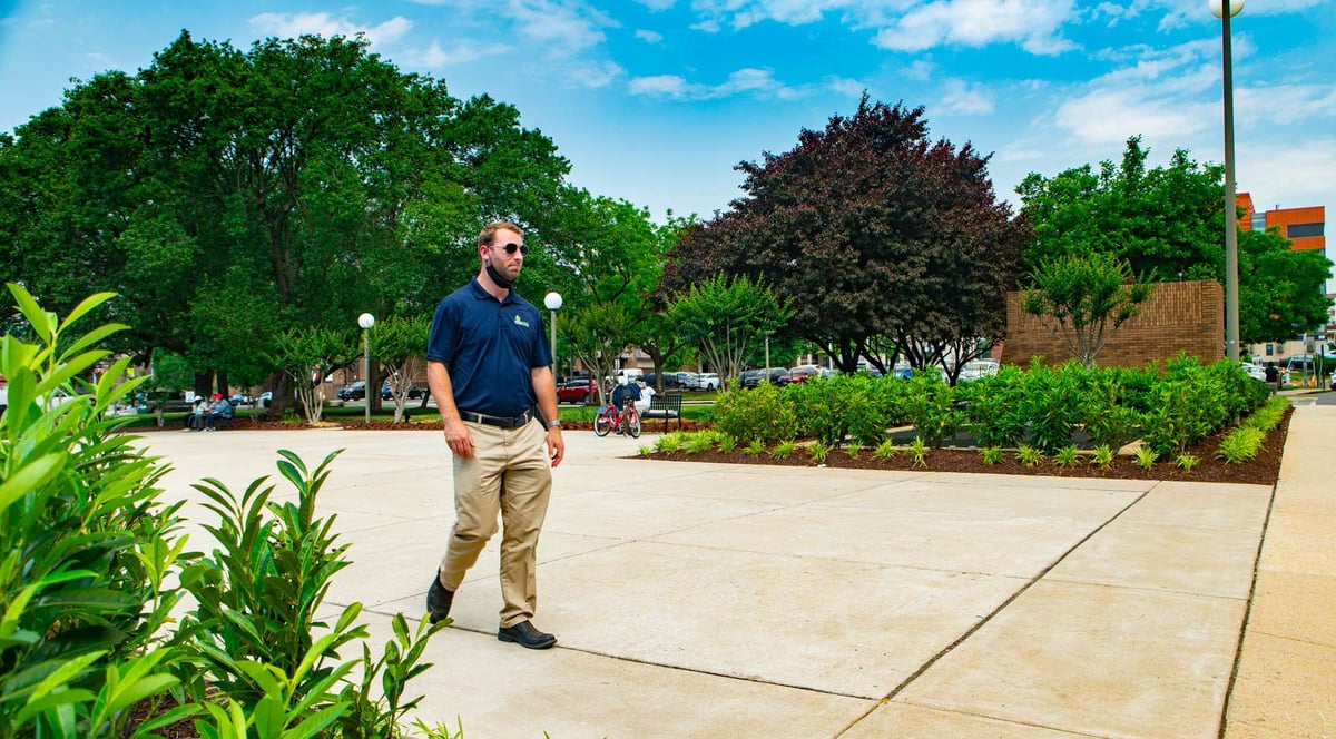 account manager inspects landscaping at howard university hospital