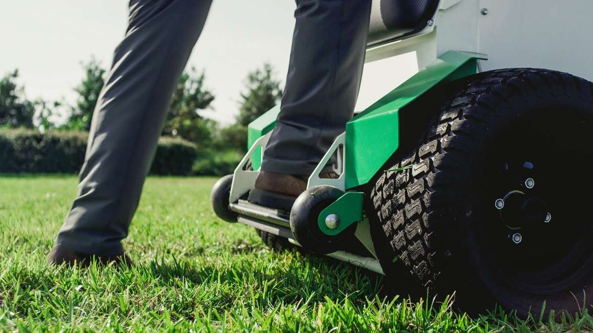 Skythe Robot Mower and team member mow lawn at commercial property