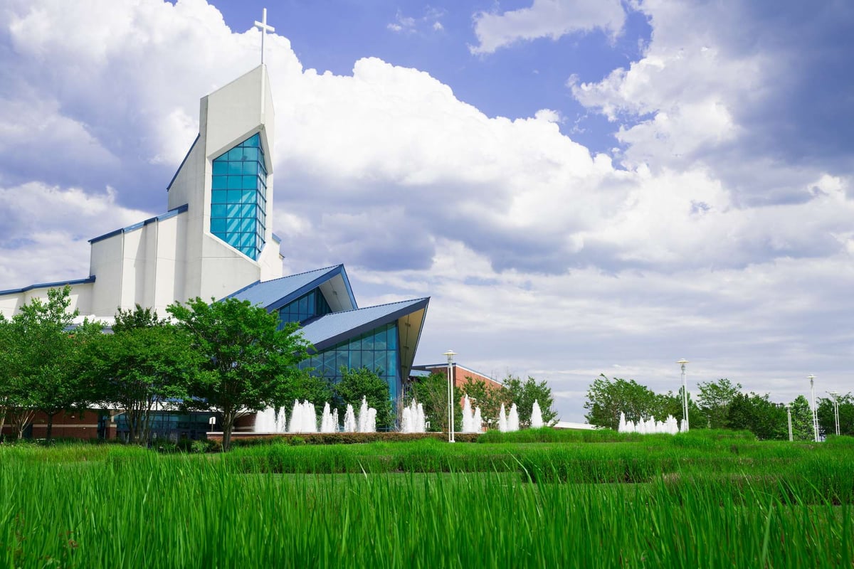 green grass in front of church